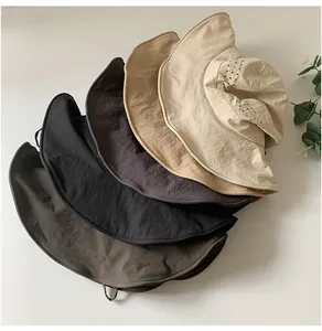 Collection of breathable wide brim bucket hats in five different earth tone colors