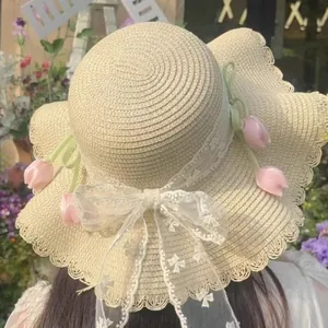 Elegant beige straw sun hat with lace bow and pink tulip floral accents for women