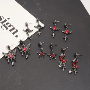 Gothic drop earrings set featuring butterfly, blood moon, and star designs with red gemstones.