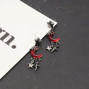 Dark gothic blood moon crescent earrings with black metallic stars for y2k style