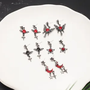 Gothic bat and blood moon earrings set with red crystals for Y2K aesthetic fashion.