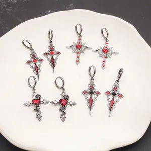 Collection of gothic dark metal cross earrings with red heart stones and floral details