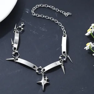 Detail view of a stainless steel punk choker with star charm and spike rivets