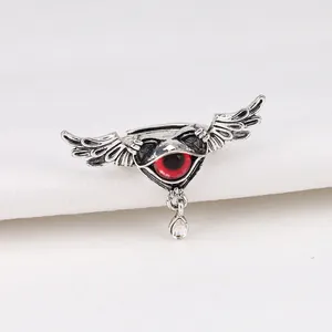 Detailed close-up of a punk winged demon eye adjustable ring featuring a red iris centerpiece.