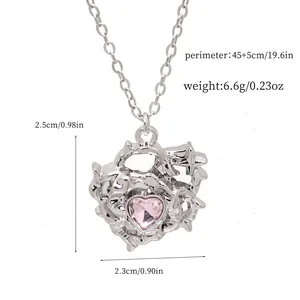 Cyber Y2K style pink heart pendant necklace with silver thorny vine metal frame detail