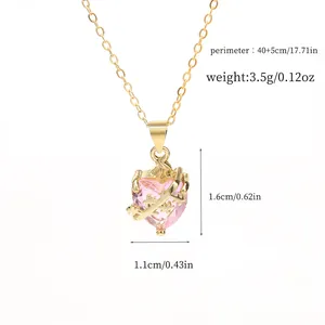 Detailed view of a pink heart crystal pendant necklace with thorn accents and dimensions