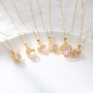 Detailed view of fairy style gold plated pink heart necklaces with thorn and crown