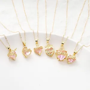 Detailed macro view of six gold-plated necklaces featuring pink crystal heart charms