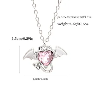 Detailed product view of pink crystal winged heart pendant necklace with size and weight info.