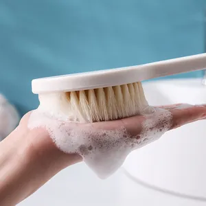 Long-handled bath brush with soft bristles for exfoliating back scrubbing in bathroom