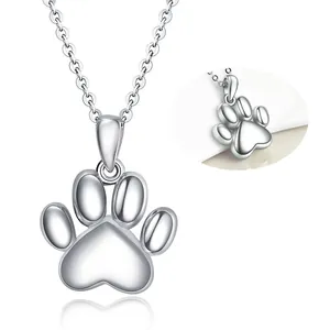 Detail view of a polished stainless steel paw print pendant cremation urn necklace for pets.