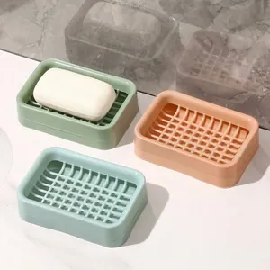 Double-layer drainage soap dish set in green, pink, and blue for bathroom