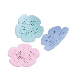 Flower-shaped silicone drain cover hair catcher set for bathroom sink and kitchen floor.