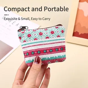 Mini portable canvas coin purse featuring colorful ethnic floral pattern and zipper