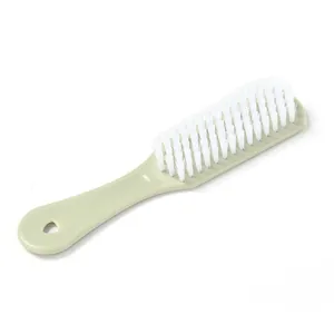 Cepillo de plástico duradero para zapatos con cerdas blancas y mango verde menta
