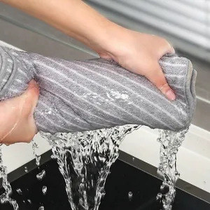 High-absorbent coral fleece microfiber kitchen towel for easy household cleaning.