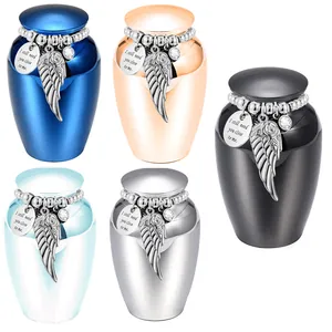 Small memorial urns set in five metallic colors with angel wing and heart charms