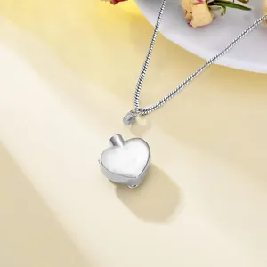 Silver heart-shaped cremation urn necklace with secure screw top on snake chain