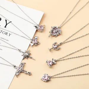 Detailed group view of silver necklaces with pink heart pendants in various gothic designs.