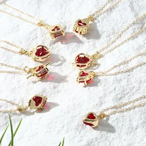 Detailed macro view of heart-shaped gold necklaces with vibrant red gemstones