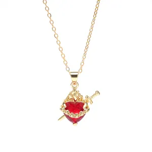 Elegant gold chain necklace featuring a red heart pendant with sword and flame motif