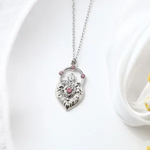 Close-up of elegant silver heart pendant necklace with sparkling pink rhinestones