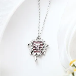 Close-up of Y2K style silver alloy heart necklace with a pink butterfly crystal pendant.