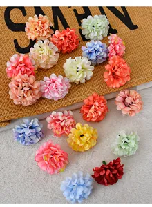 Macro view of multi-colored silk artificial chrysanthemum flower heads on a rustic burlap