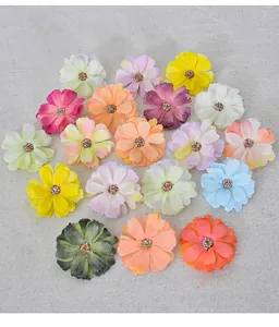 Detailed view of colorful artificial daisy flower heads with glitter centers for DIY