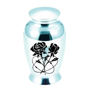 Detailed macro view of light blue alloy cremation urn with black rose pattern engraving