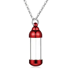 Detailed close-up view of red and transparent cremation urn pendant necklace for ashes