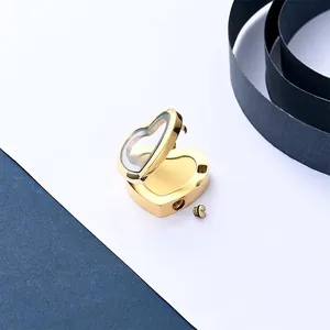 Detailed view of an open gold heart-shaped stainless steel memorial locket pendant