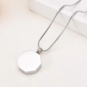 Detailed macro view of minimalist octagonal silver cremation urn pendant necklace