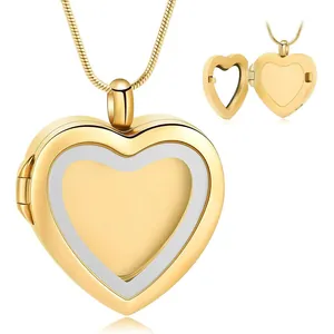 Detail of a gold heart-shaped locket pendant showing the hinged opening and photo frame.