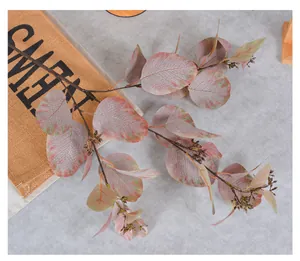 Detailed macro view of artificial eucalyptus branch leaves and berries for home decoration
