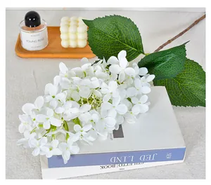 Detailed close-up showing the realistic texture of white artificial hydrangea flowers