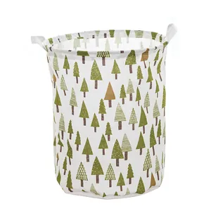 Collapsible canvas fabric laundry hamper basket with cute green forest tree patterns