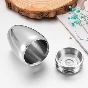 Detail view of silver egg-shaped stainless steel cremation urn with open screw lid