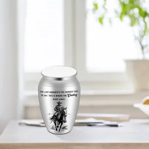 Memorial cremation urn for human or pet ashes with cowboy on horse engraving and quote