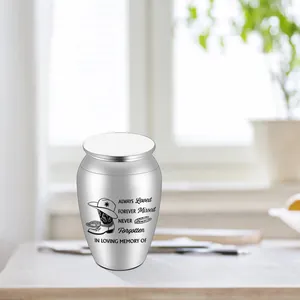 Engraved silver memorial urn for pets or loved ones with cowboy boots and hat design