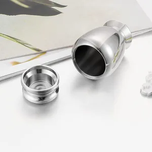 Detailed macro view of open polished silver stainless steel cremation memorial urn