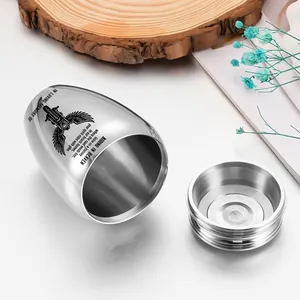 Detailed close-up of open stainless steel motorcycle cremation urn with engraved poem.