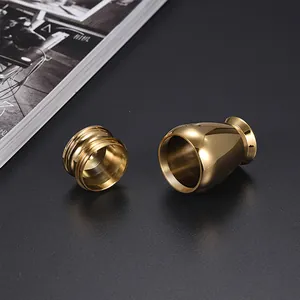 Macro view of a gold-toned aluminum miniature cremation urn with open screw lid for pets