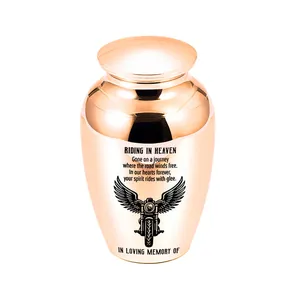 Detailed view of rose gold cremation urn with engraved motorcycle and memorial text