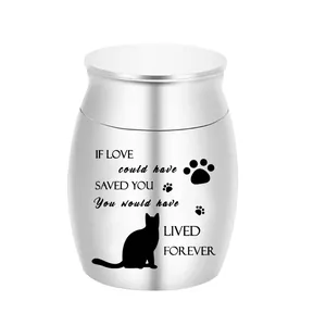 Detail of silver pet cremation urn featuring cat silhouette and memorial quote
