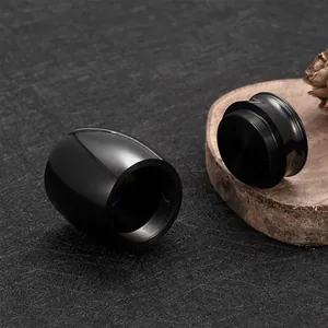 Detail view of a premium black metal pet cremation urn with a secure screw-top lid