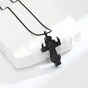 Close-up detail of black antler cross cremation pendant necklace with black stones