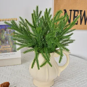 Artificial Norfolk pine needle bundle in cream vase for rustic Christmas home decor