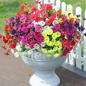 Vibrant artificial morning glory flowers in a decorative planter for garden decor