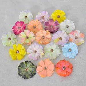 Various colorful artificial small daisy flower heads for DIY handmade crafts and decoration